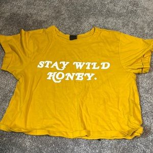 An extra small mustard crop top